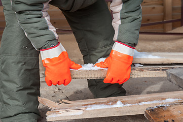 Image showing Carpenter working at sawmill