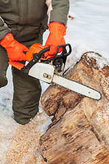 Image showing Carpenter working at sawmill