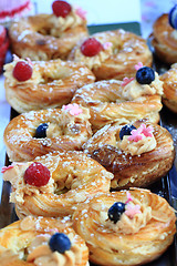 Image showing cream puff with raspberries and blueberries