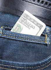 Image showing Stack of dollar bills in jeans pocket