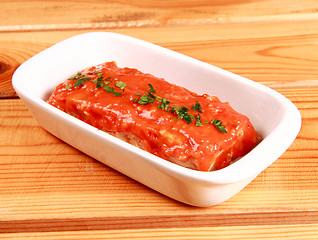 Image showing red lasagna isolated on wooden background