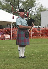 Image showing A Scot Playing Pipes