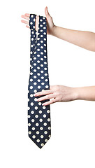 Image showing woman holding polka dot tie