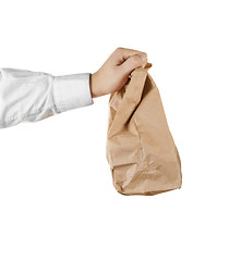 Image showing Man holding a brown paper bag in his hand