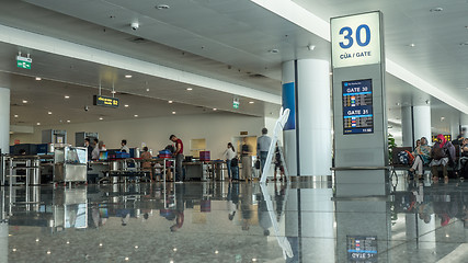 Image showing Airport hall with people in security checkpoint. Hanoi, Vietnam