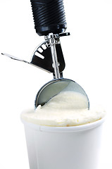 Image showing Tub of vanilla ice cream with a scoop