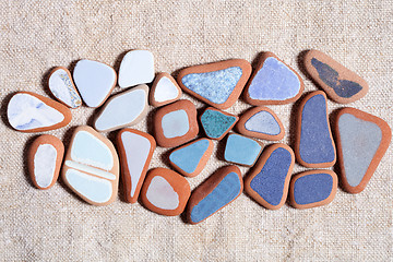 Image showing pieces of colorful tiles polished by the sea 