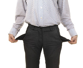 Image showing businessman showing the pocket of his pants empty