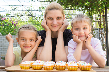 Image showing Mother and two daughters have prepared Easter cupcakes