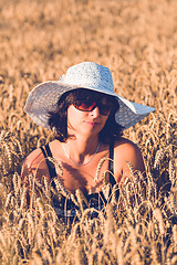 Image showing Middle aged beauty woman in wheat field