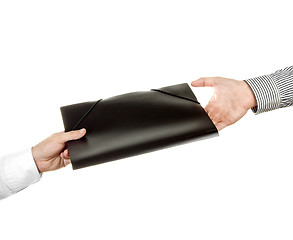 Image showing Hand holding a folder