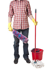 Image showing Young sweeping man workwear. Isolated