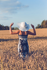 Image showing Middle aged beauty woman in wheat field