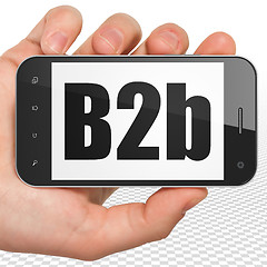Image showing Business concept: Hand Holding Smartphone with B2b on display