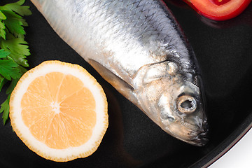 Image showing fish on pan with lemon