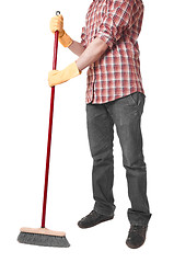 Image showing young worker with a broom