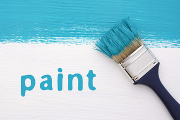 Image showing Stripe of turquoise paint, paintbrush and the word PAINT