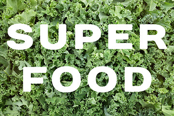 Image showing SUPERFOOD text over shredded kale leaves background