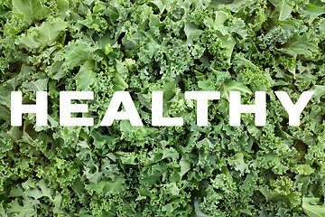 Image showing HEALTHY text over shredded kale leaves background