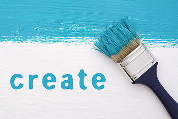 Image showing Stripe of turquoise paint, paintbrush and the word CREATE