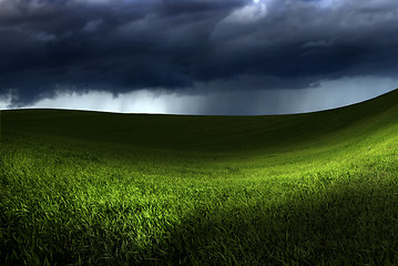 Image showing Green land over a storm