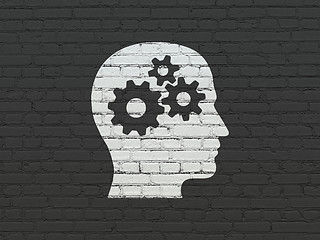 Image showing Advertising concept: Head With Gears on wall background