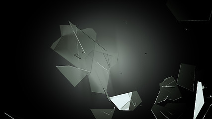 Image showing Many pieces of shattered glass on black