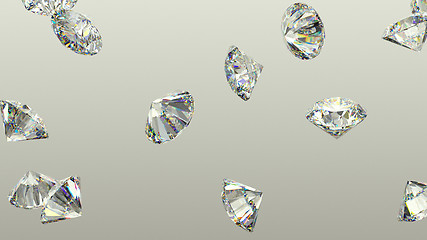 Image showing Diamonds scattering or flying away over studio background