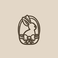 Image showing Easter bunny sitting in basket sketch icon.