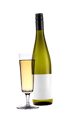 Image showing Full white wine glass goblet and bottle isolated