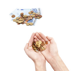 Image showing Male hands holding coins isolated