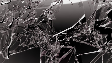 Image showing Sharp Pieces of shattered glass isolated on black