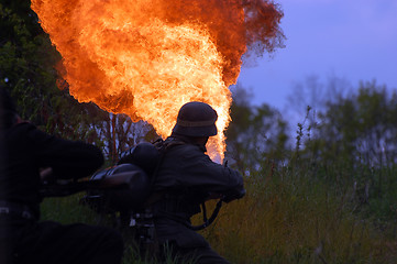 Image showing German soldier with flame-thrower . WW2 reenacting