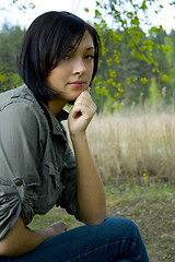 Image showing young sad woman in the forest