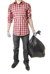 Image showing Man holding black plastic trash bag