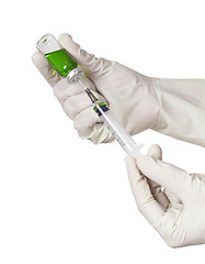 Image showing Hand holding syringe isolated on white