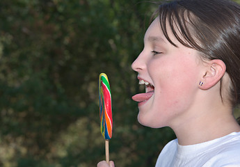 Image showing teenager with lollipop