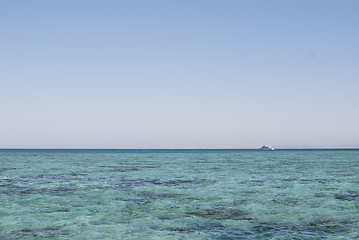 Image showing Photo closeup of beautiful clear turquoise sea ocean water surface with ripples low waves on seascape background, horizontal picture