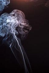 Image showing Beautiful smoke on the black background - macro photo