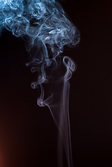 Image showing Beautiful smoke on the black background - macro photo