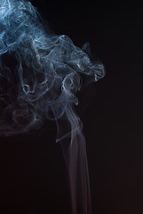 Image showing Beautiful smoke on the black background - macro photo