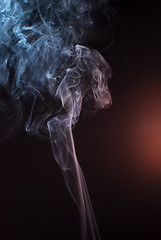 Image showing Beautiful smoke on the black background - macro photo