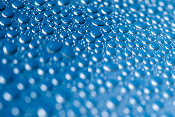 Image showing close-up of water drops on the blue background 