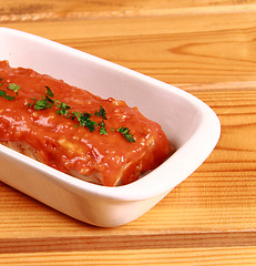 Image showing red lasagna isolated on wooden background