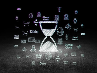 Image showing Time concept: Hourglass in grunge dark room