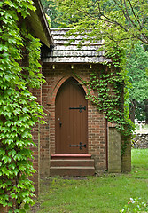 Image showing vine covered church building