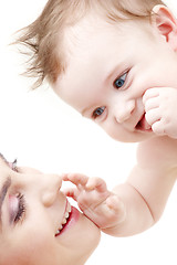 Image showing happy blue-eyed baby boy touching mama