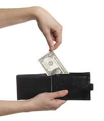 Image showing hand-pulling the dollar from purse isolaetd