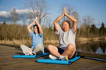 Image showing Senior asian couple exercise