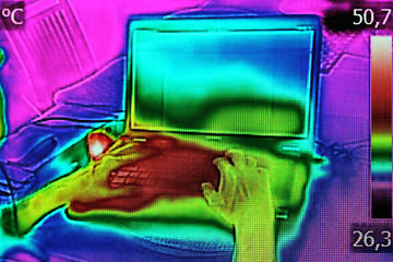 Image showing Infrared image showing the heat emission when woman used noteboo
